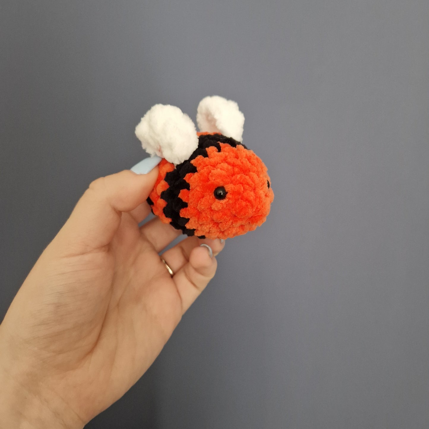 Orange coloured chunky crochet bee keyring
