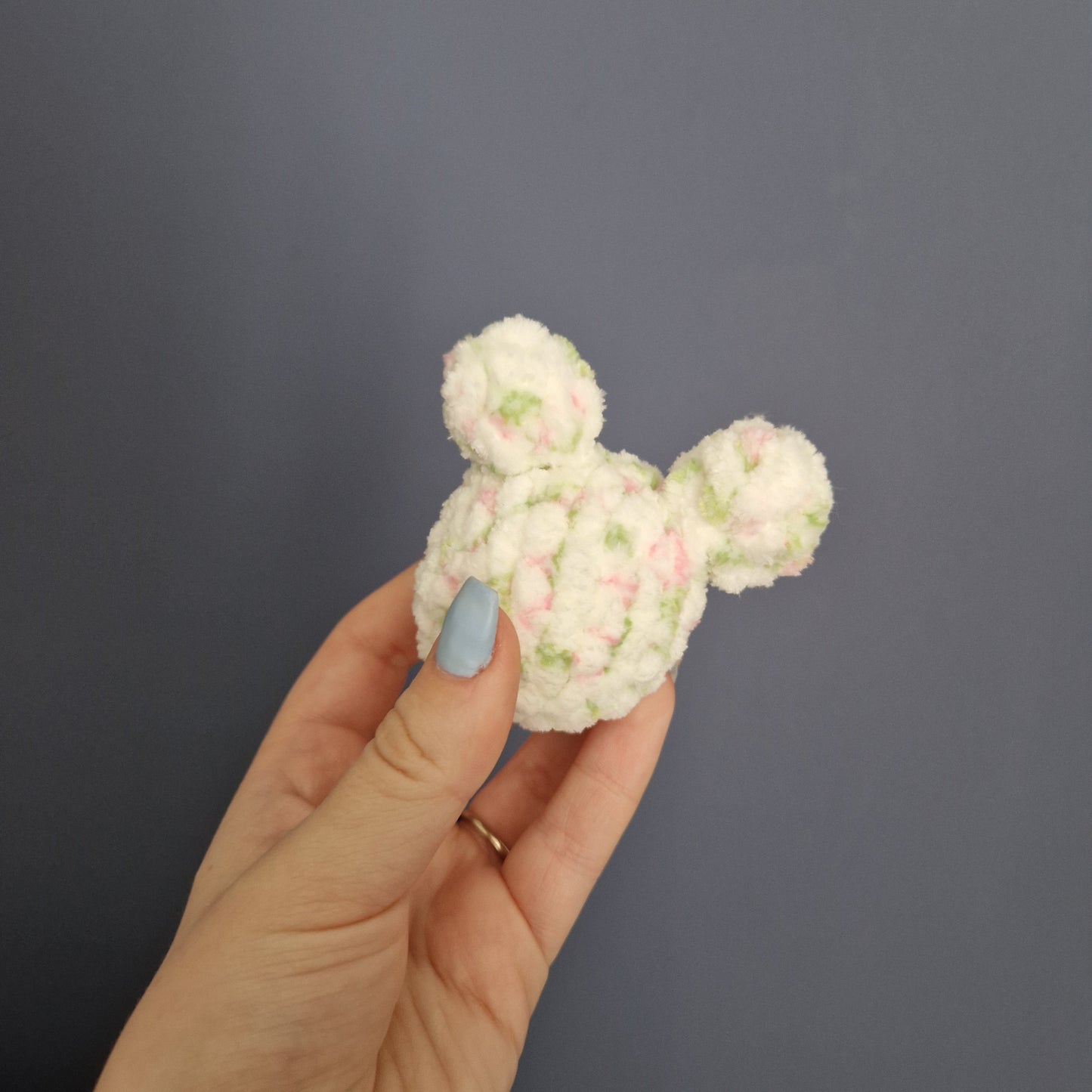 White, pink and green floral coloured chunky crochet bee keyring