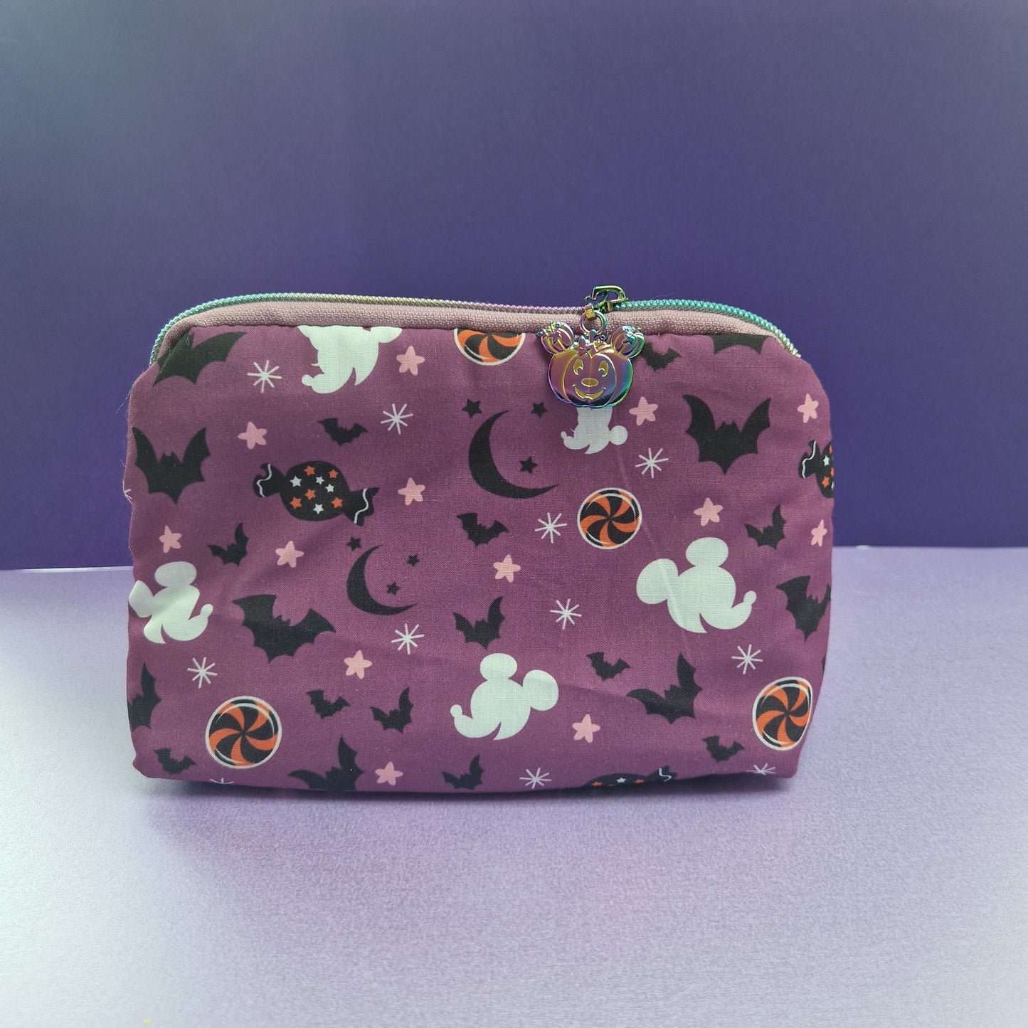 Spooky Mouse lined triangle cosmetic bag with pumpkin zipper pull