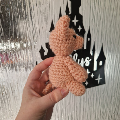 Pink crochet sitting pig