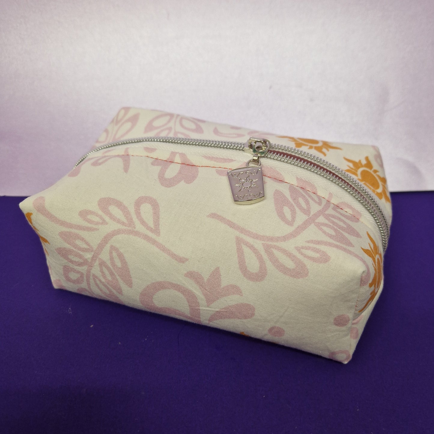 Floral Sun boxy pouch cosmetic bag with a floating lantern zipper pull