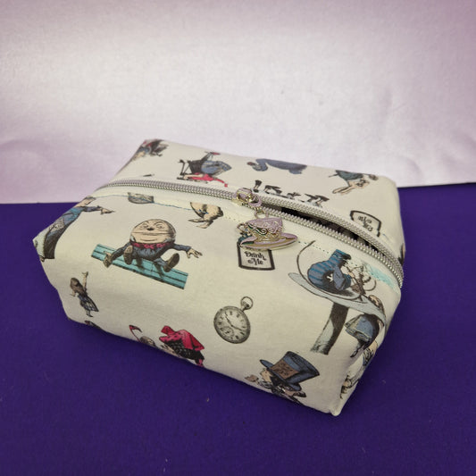 Wonderland boxy pouch cosmetic bag with a tea cup zipper pull