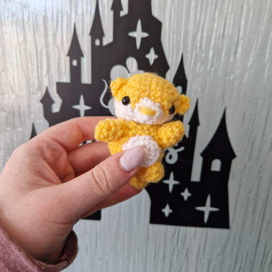 Small bright yellow crochet otter