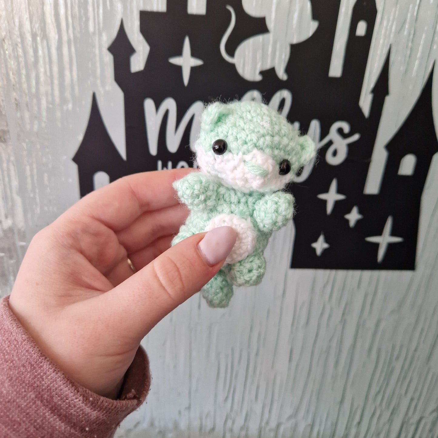 Small mint green crochet otter