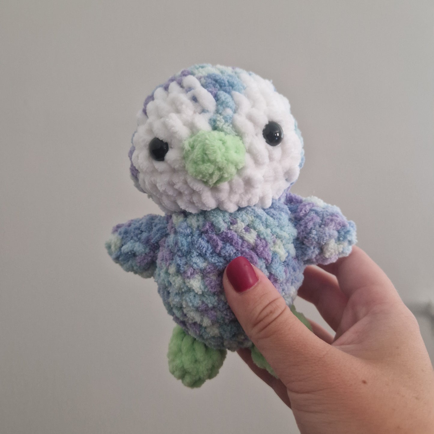 Blue, green and purple penguin crochet plushie