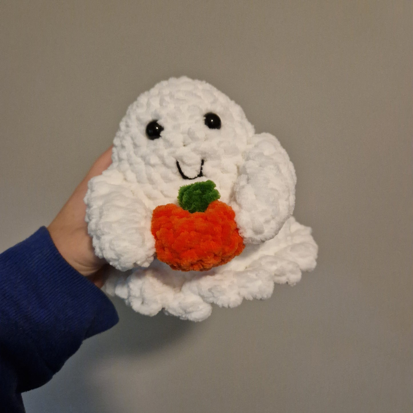 Spooky ghost holding an accessory crochet plushie