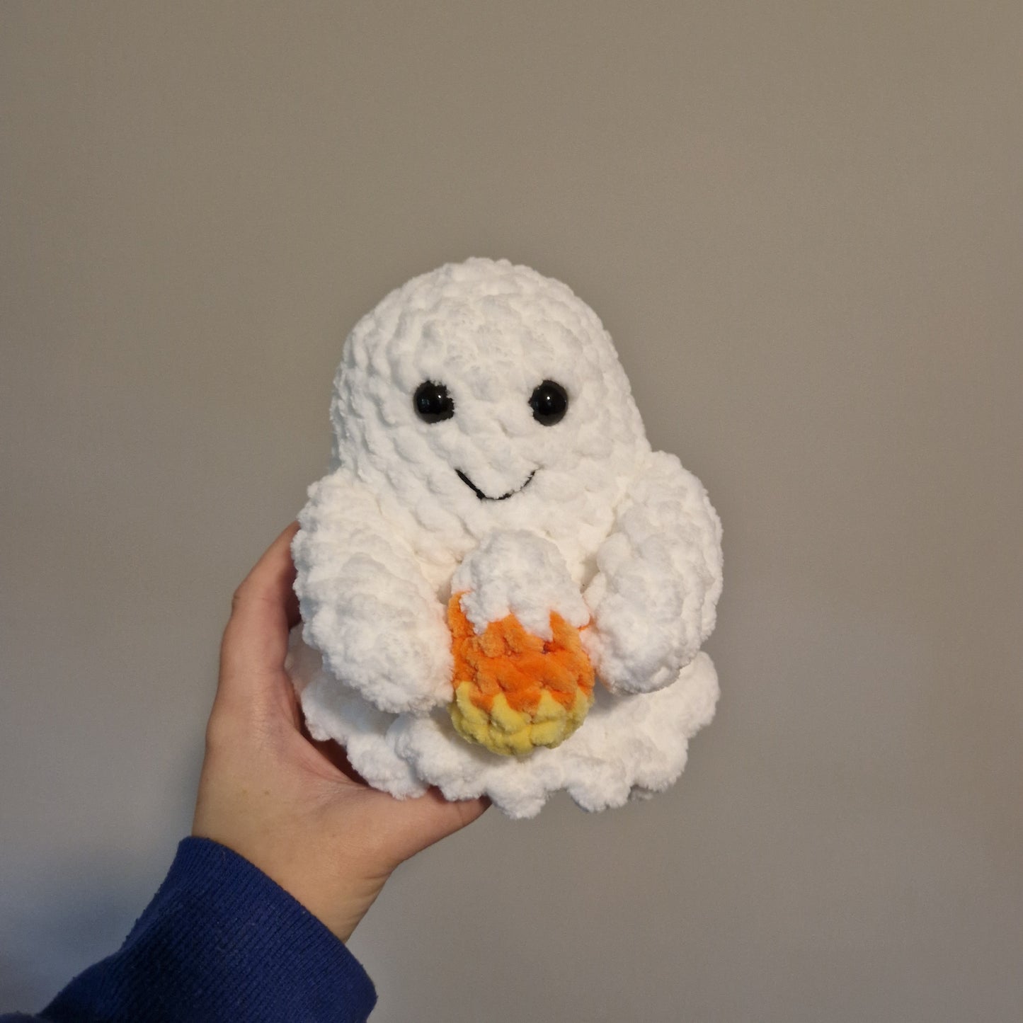 Spooky ghost holding an accessory crochet plushie