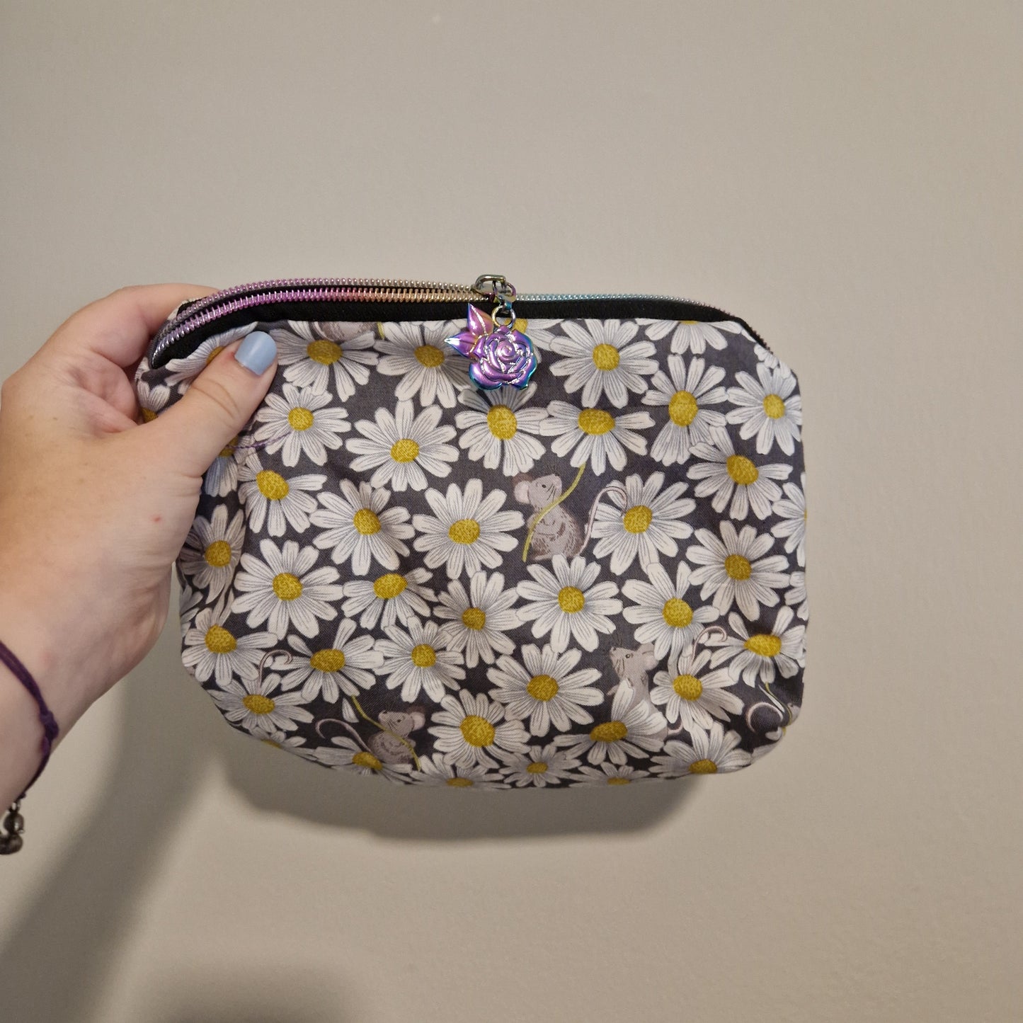 Daisy mouse lined triangle cosmetic bag with water tower zipper pull