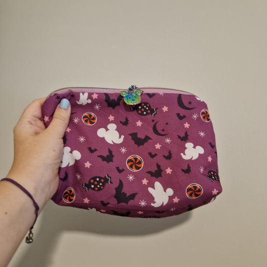 Spooky mouse lined triangle cosmetic bag with water tower zipper pull