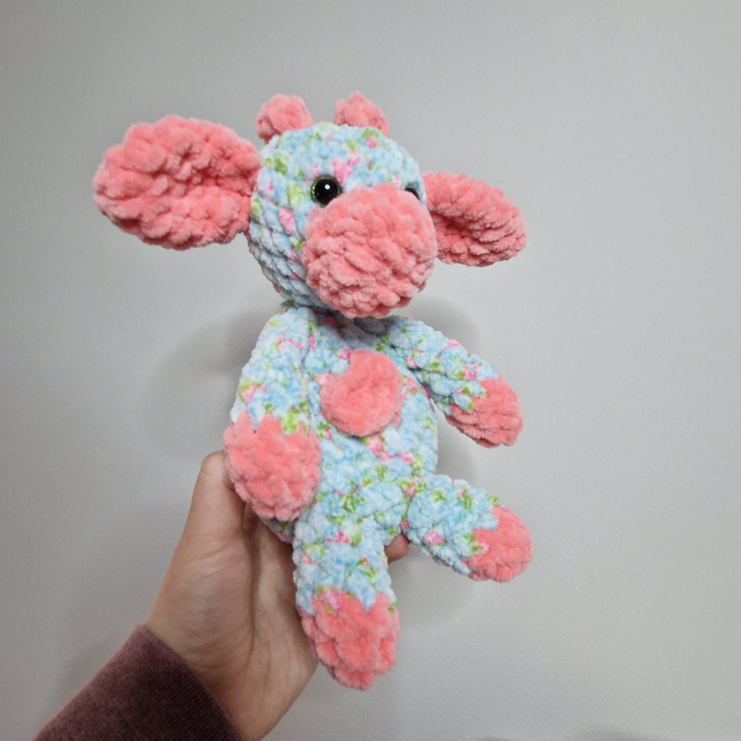 Pink and blue floral sitting cow crochet plushie