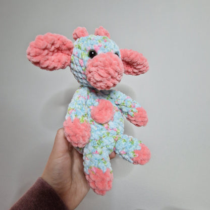 Pink and blue floral sitting cow crochet plushie