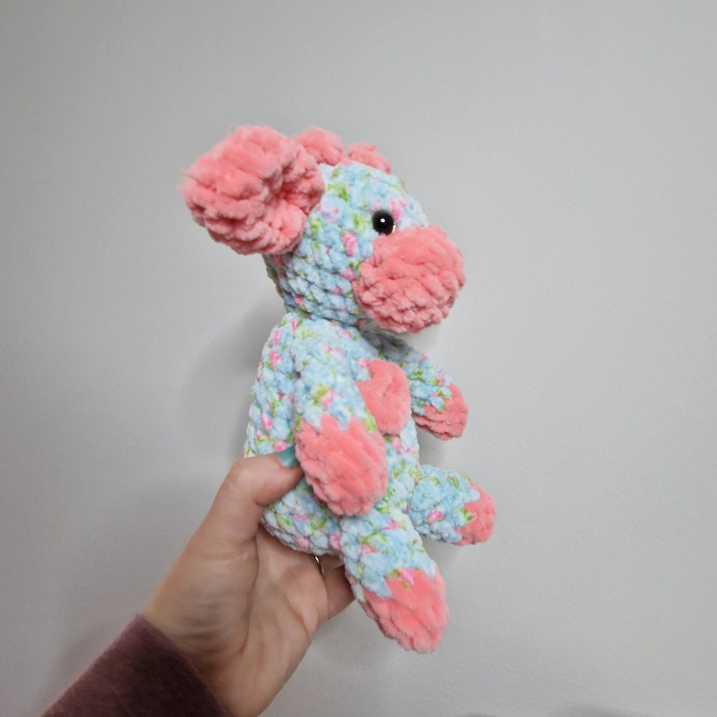 Pink and blue floral sitting cow crochet plushie