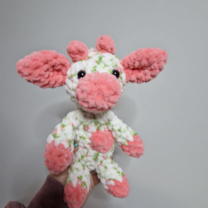 Pink and white floral sitting cow crochet plushie