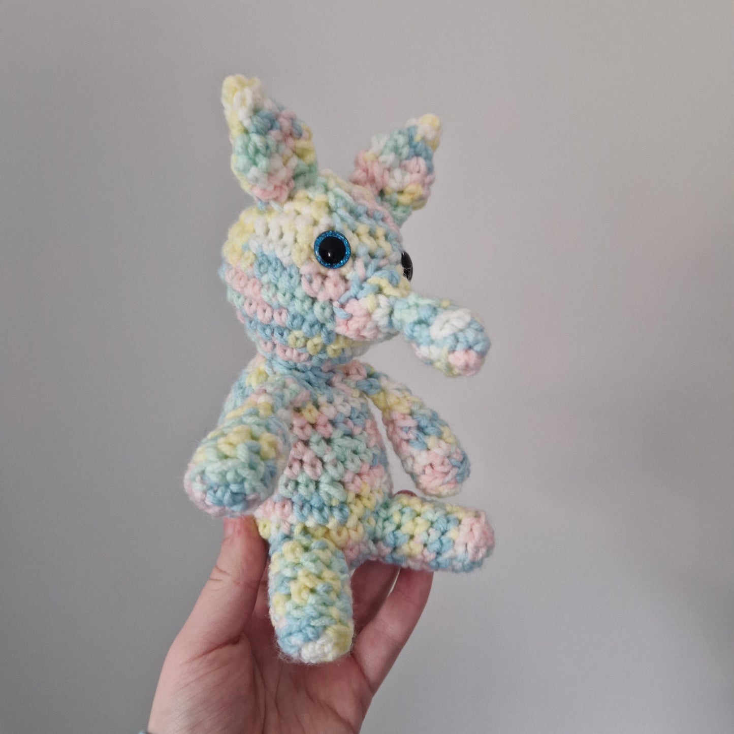 Pastel Rainbow crochet sitting aardvark