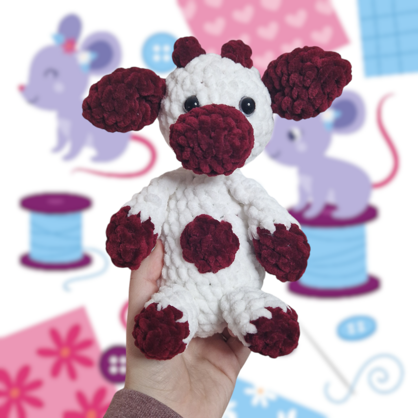 Red and white sitting cow crochet plushie