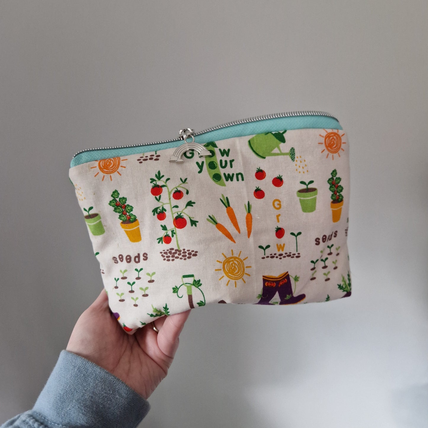 Vegetable Garden themed lined triangle cosmetic bag with matching zipper pull