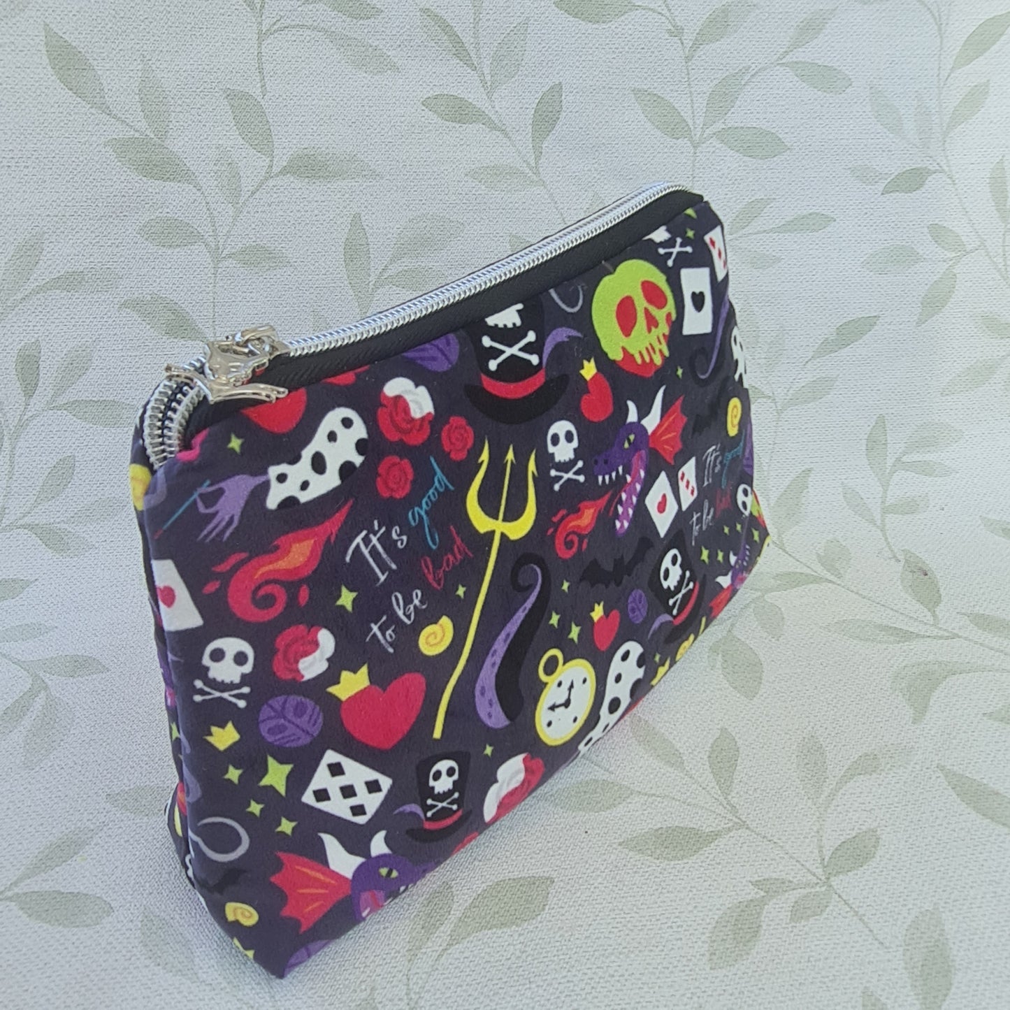 Velvet Mixed Villains lined triangle cosmetic bag with zipper