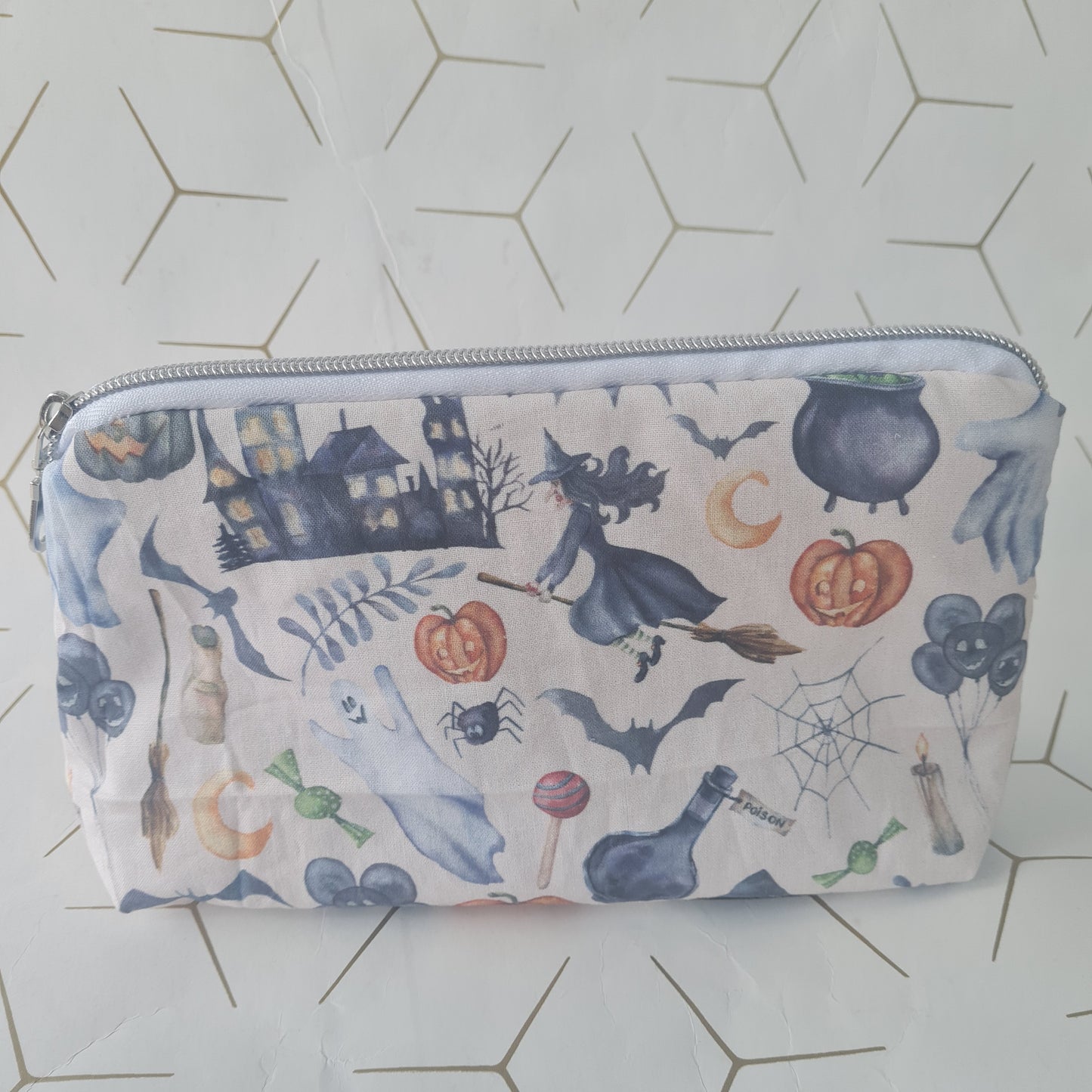 Spooky lined triangle cosmetic bag with zipper