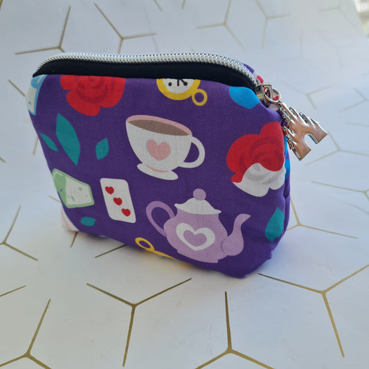 Wonderland mini icon lined triangle cosmetic bag with zipper