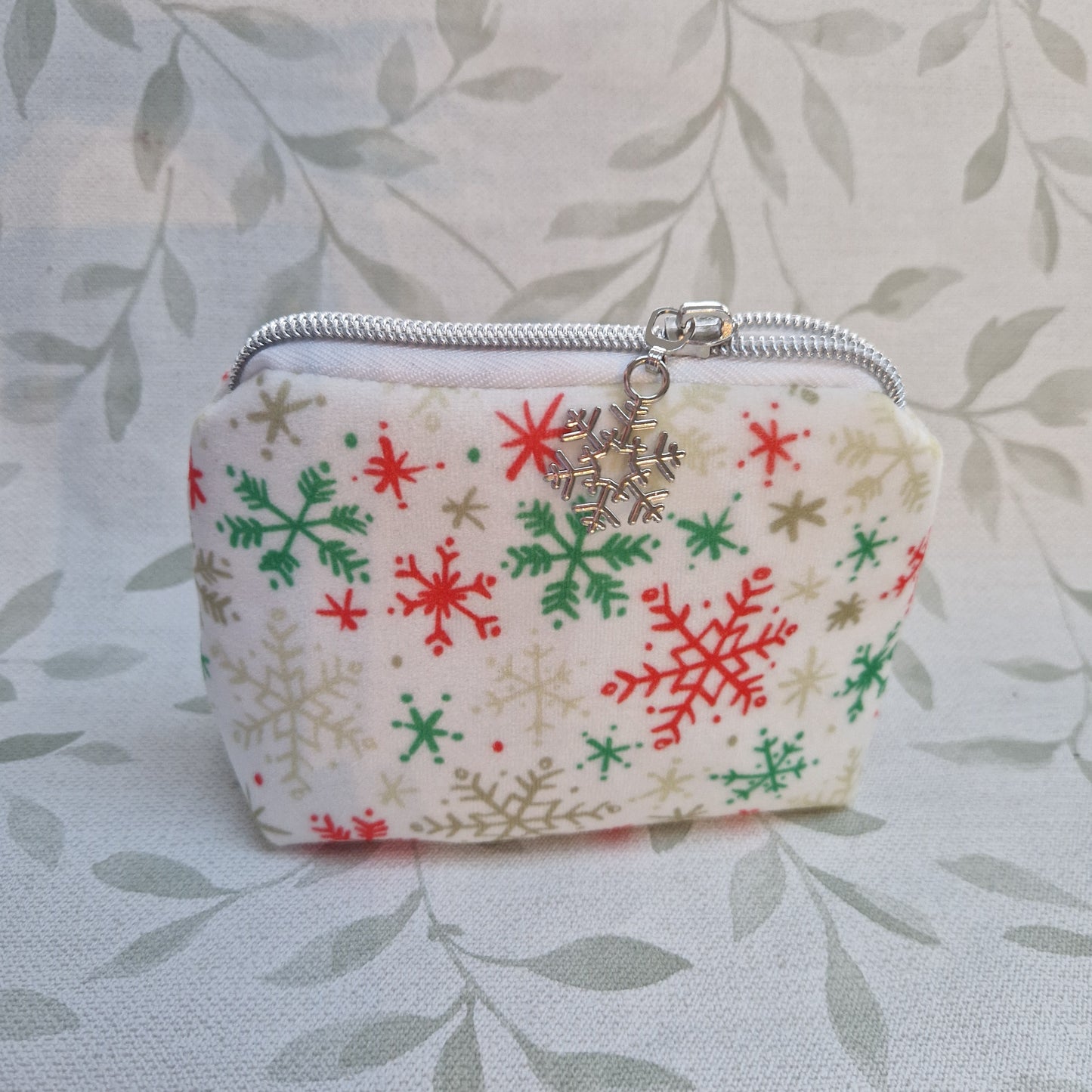 Mini velvet red, green, white snowflake lined triangle cosmetic bag with zipper