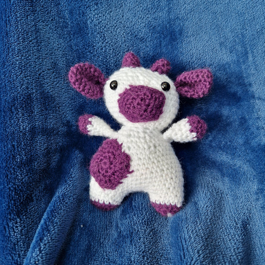 Purple and white crochet cow