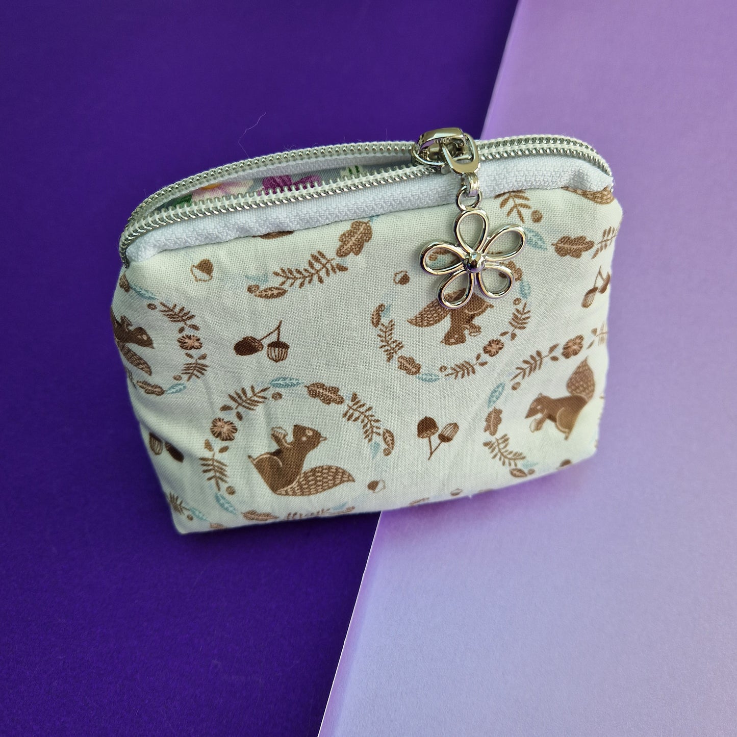 Squirrel lined triangle cosmetic bag with zipper